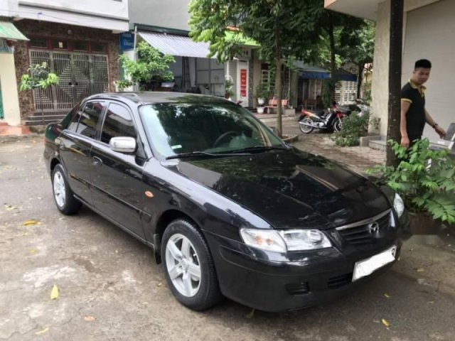 Bán xe Mazda 626 đời 2004, màu đen, còn rất chất0