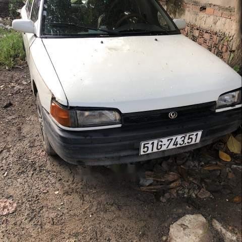 Bán Mazda 323 đời 1996 màu trắng, máy còn chạy ngon