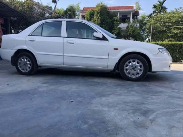 Gia đình bán xe Mazda 323 năm 2001, màu trắng, giá chỉ 155 triệu