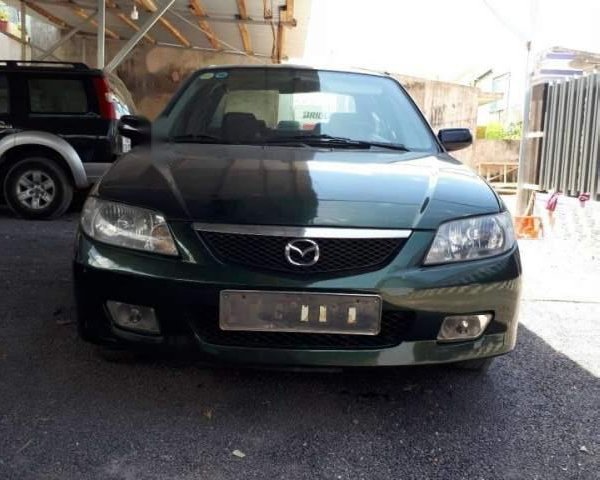 Bán Mazda 323 năm sản xuất 2002, màu đen, xe nhập 