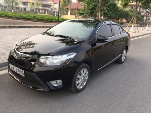 Cần bán gấp Toyota Vios E sản xuất 2014, màu đen xe gia đình0