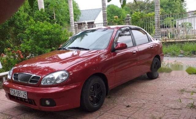 Cần bán xe Daewoo Lanos đời 2001, màu đỏ, xe đẹp không một vết trầy xước, máy êm0