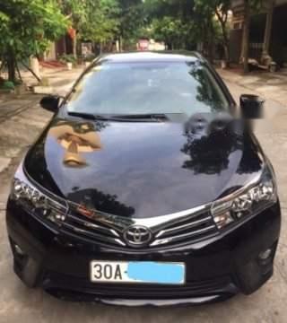 Bán Toyota Corolla Altis 1.8G AT 2014, màu đen xe gia đình0