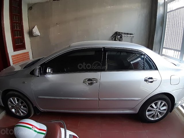 Bán Toyota Corolla altis 1.8E AT sản xuất năm 2010, màu bạc  