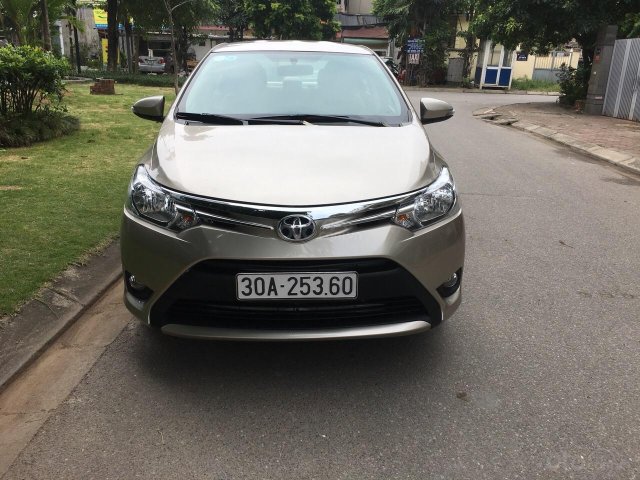 Bán Toyota Vios E năm sản xuất 2014, màu vàng, xe gia đình 0