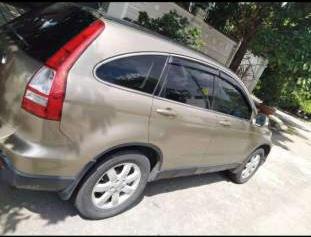 Cần bán xe Honda CR V đời 2009, màu vàng cát