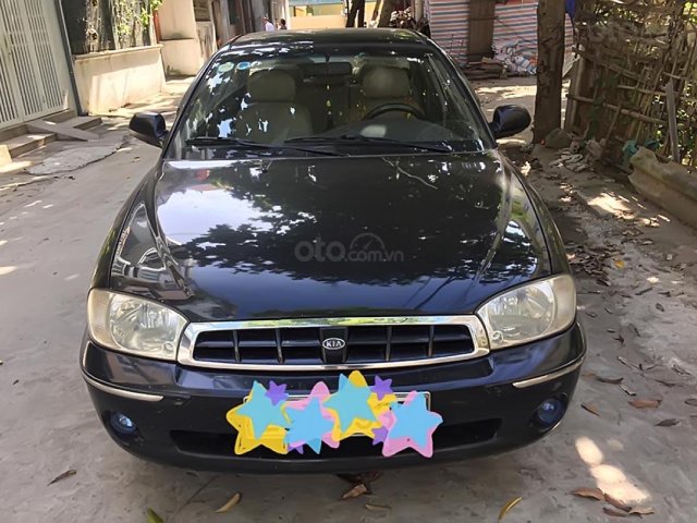 Cần bán Kia Spectra đời 2003, màu đen0