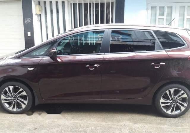 Bán xe Kia Rondo 5+2 đời 2017, số sàn màu nâu, đăng ký tháng 10 năm 20170