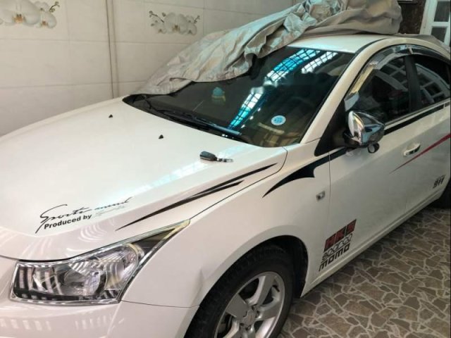 Bán xe Chevrolet Cruze 1.6 LS đời 2012, màu trắng, đã đi gần 12.000km0