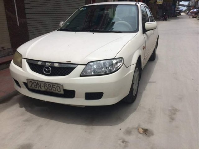 Bán Mazda 323 năm sản xuất 2002, màu trắng, nhập khẩu nguyên chiếc 0