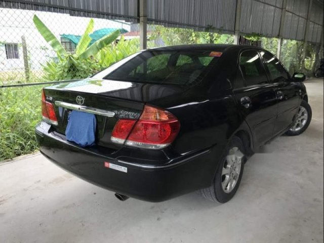 Gia đình bán lại xe Toyota Camry 2.4G năm 2006, màu đen0