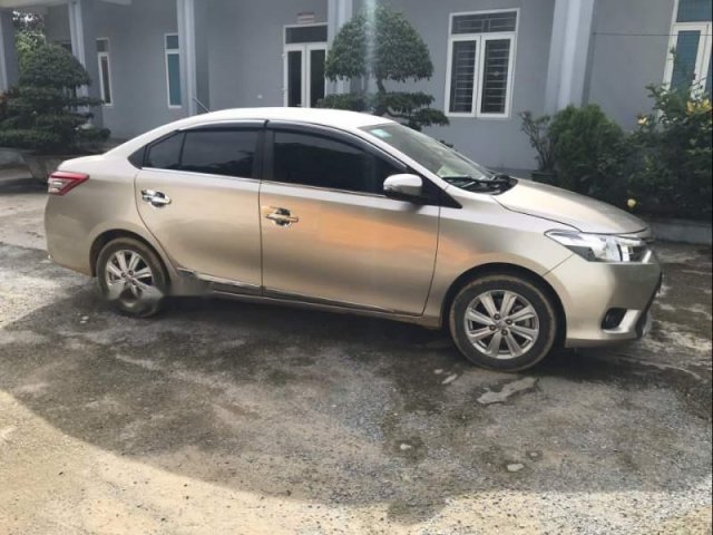 Cần bán xe Toyota Vios 1.5MT đời 2016, màu vàng cát