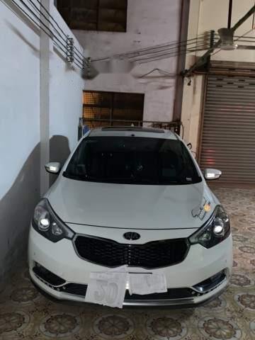 Cần bán gấp Kia Cerato đời 2014, màu trắng, nhập khẩu, xe còn mới, ít sử dụng0