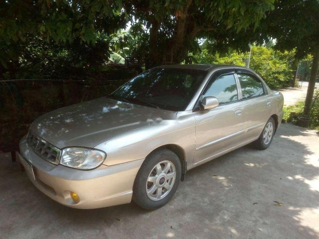 Bán xe Kia Spectra năm sản xuất 2005, màu vàng cát0