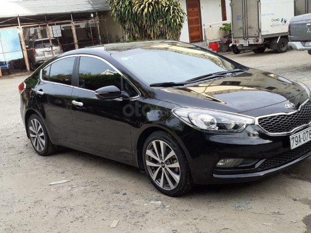 Nhu cầu đổi xe 7 chỗ nên bán Kia K3 1.6AT 2014