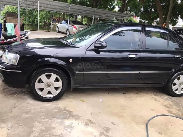 Bán Ford Laser GHIA 1.8 MT 2003, màu đen, chính chủ