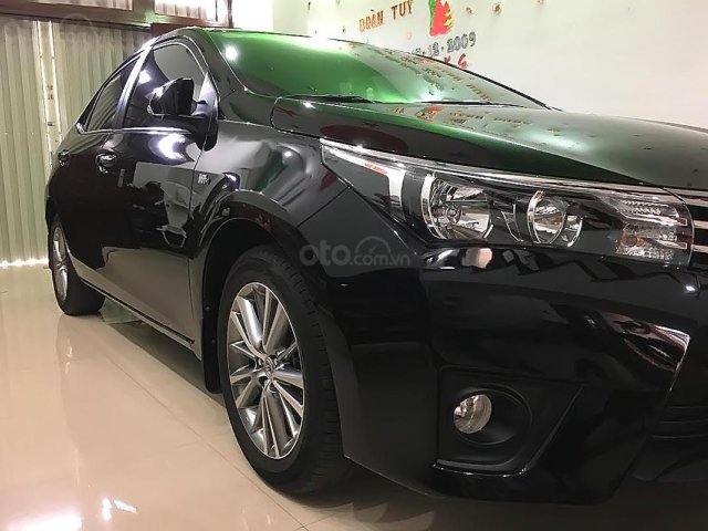 Bán Toyota Corolla Altis 1.8G AT đời 2015, màu đen còn mới