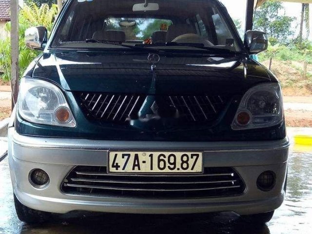 Cần bán Mitsubishi Jolie đời 2004, màu xanh dưa0