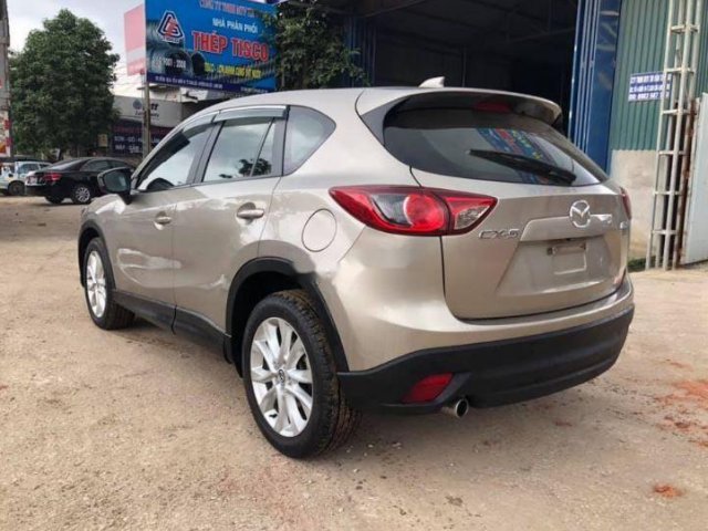 Bán xe Mazda CX 5 đời 2013, màu vàng cát0