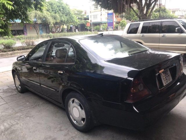 Cần bán Daewoo Magnus đời 2004, màu đen, xe nhập0