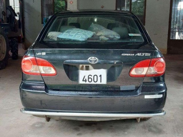 Gia đình bán Toyota Corolla Altis đời 2005, màu xanh lá0