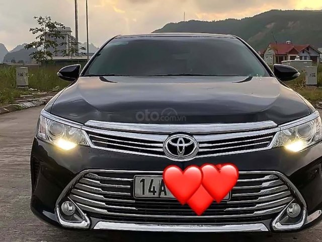 Cần bán gấp Toyota Camry sản xuất năm 2016, màu đen chính chủ, giá 970tr