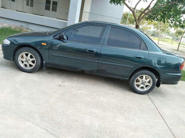 Bán xe Mazda 323 1999, nhập khẩu, màu xanh dưa0