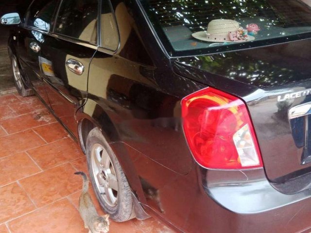 Cần bán Daewoo Lacetti năm 2009, màu đen số sàn, giá tốt xe nguyên bản0