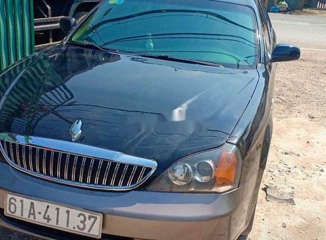 Cần bán lại xe Daewoo Magnus sản xuất năm 2005, màu đen xe gia đình xe nguyên bản0