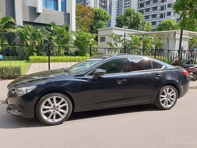 Cần bán xe Mazda 6 năm sản xuất 2014, màu đen, giá 660tr xe còn mới lắm