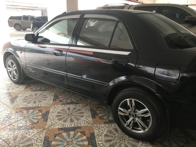 Bán Mazda 323 đời 2003, màu đen xe gia đình, giá tốt0