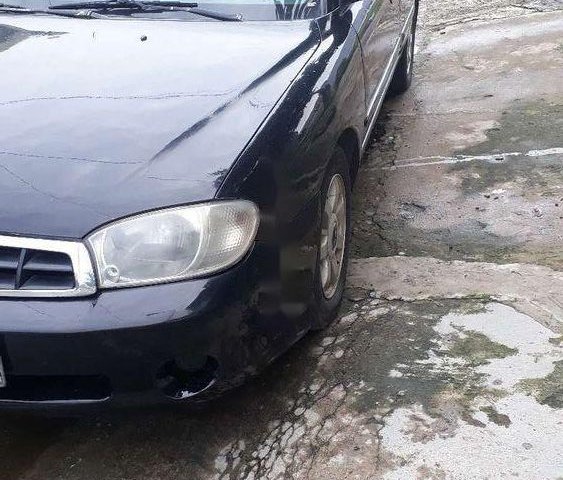 Cần bán lại Kia Spectra sản xuất năm 2005, màu đen, giá chỉ 90 triệu