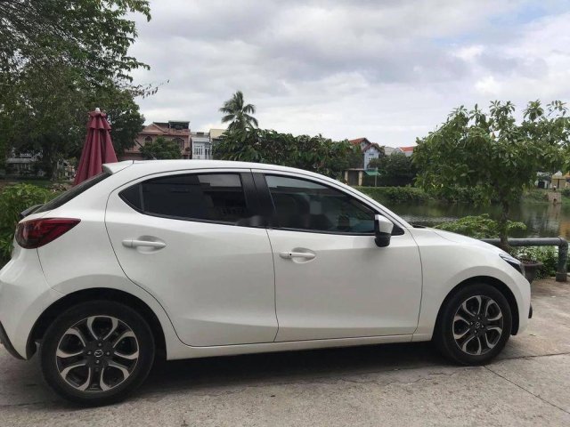 Bán ô tô Mazda 2 đời 2016, màu trắng chính chủ0