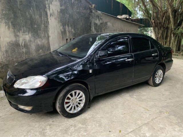 Cần bán lại xe Toyota Corolla Altis 2003, màu đen0