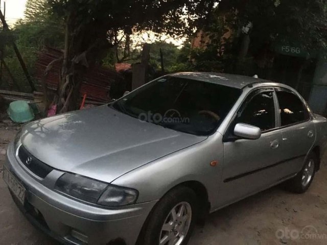 Cần bán lại xe Mazda 323 1.6 MT sản xuất năm 1999, màu bạc xe gia đình, giá 124tr0