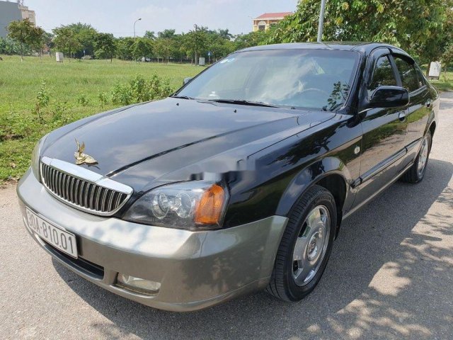 Cần bán lại xe Daewoo Magnus sản xuất năm 2004, màu đen còn mới0