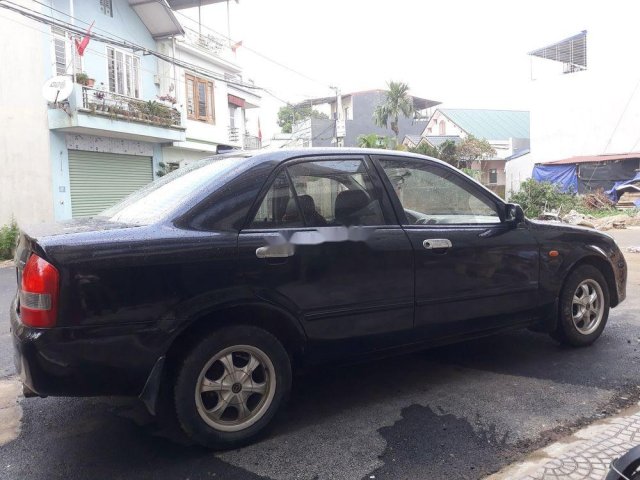 Bán Mazda 323 sản xuất 2004, màu đen còn mới, 139 triệu0