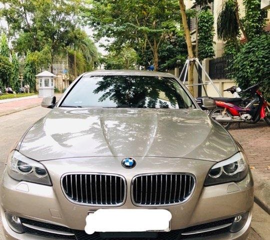 Cần bán xe chính chủ BMW 5 Series 523i đời 2011, màu vàng, dáng xe đẹp như mới