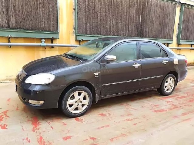 Cần bán Toyota Corolla Altis đời 2006, màu đen số sàn, 310tr