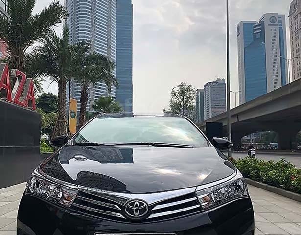 Bán Toyota Corolla Altis 1.8G AT năm sản xuất 2016, màu đen, giá 678tr0