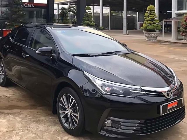 Cần bán Toyota Corolla Altis 1.8G năm 2018, màu đen0