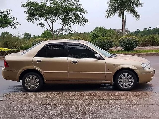 Bán Ford Laser GHIA 1.8 AT năm 2003, màu vàng còn mới0