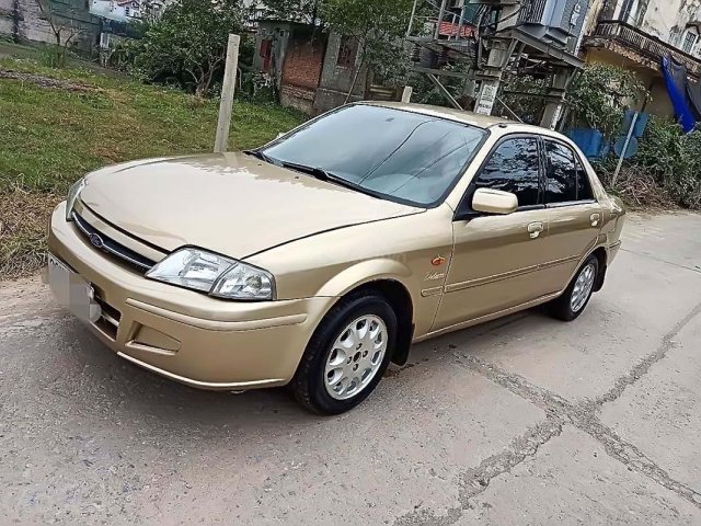 Bán Ford Laser năm 2001, màu vàng, 125tr