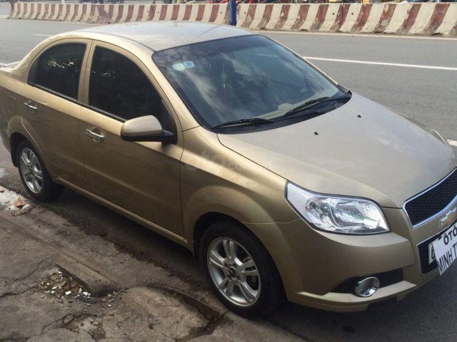 Bán Chevrolet Aveo sản xuất 2014, màu vàng cát, đi 35,000km, xe zin đẹp0