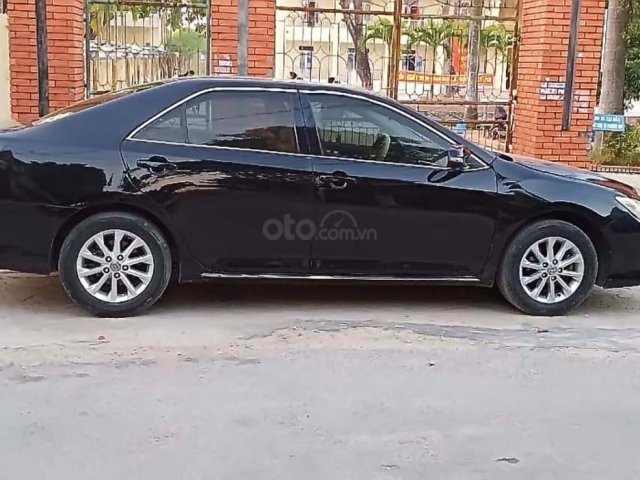 Bán xe Toyota Camry năm 2014, màu đen như mới, giá chỉ 610 triệu0