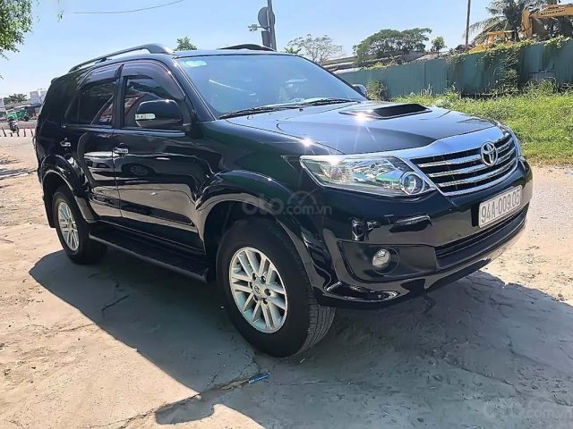 Bán Toyota Fortuner G đời 2014, màu đen số sàn, 700 triệu