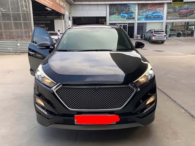 Bán ô tô Hyundai Tucson sản xuất 2017, màu đen số tự động, giá tốt xe còn mới lắm0