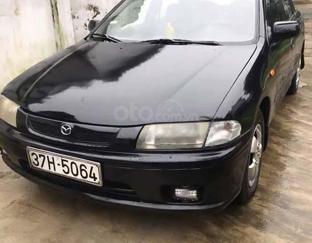 Bán ô tô Mazda 323 đời 1998, màu đen0