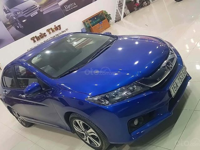 Cần bán lại xe Honda City AT năm sản xuất 2014, màu xanh lam số tự động0