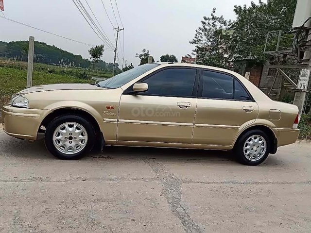 Cần bán gấp Ford Laser MT đời 2001, màu vàng xe gia đình0